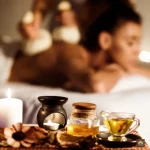 A person comfortably lying in bed for massage.