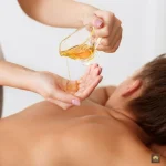 A massage expert pouring oil and doing Thai massage.